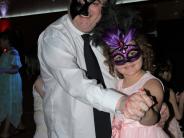 dancing picture of dad and daughter in masks